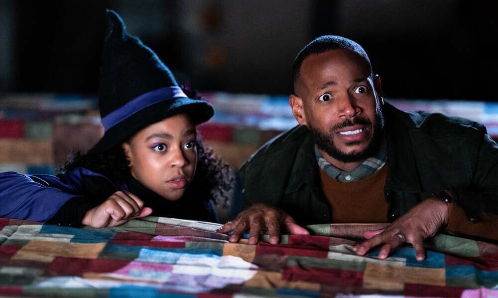 Man and woman looking concerned in Curse of Bridge Hollow