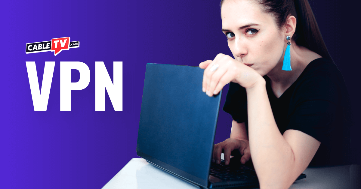 A woman shielding her laptop screen, illustrating the online security and privacy provided by a VPN.