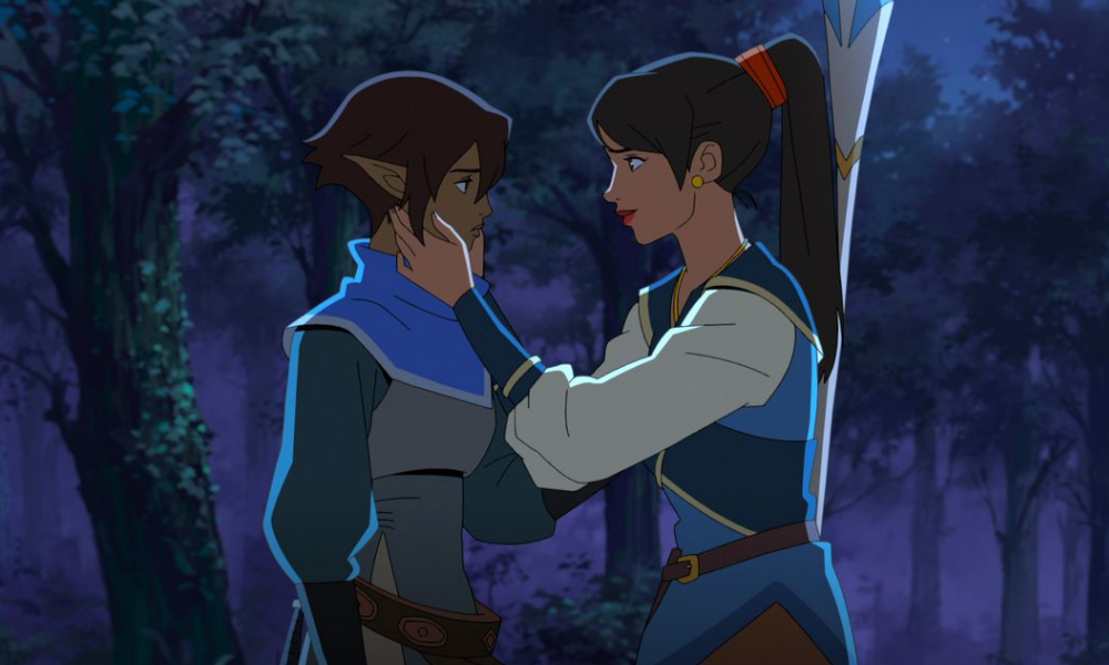 DragonAge1000x600 A human woman with a ponytail caresses the cheek of an elven woman with dark skin and short hair.