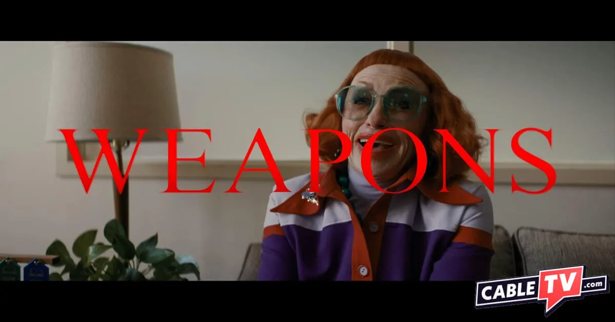 A still image from the movie Weapons shows a pleasant-looking redheaded woman on a couch in an office. The film title and CableTV.com logo are laid over the image.