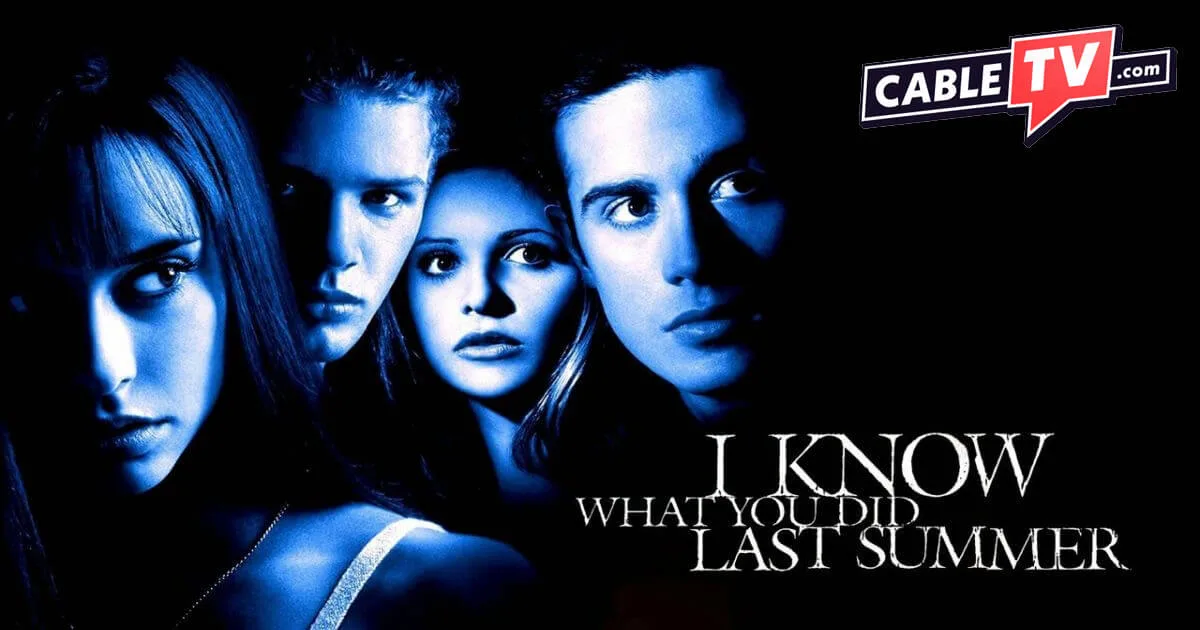Over a black background, a blue-hued cast photo shows the four main cast members of I Know What You Did Last Summer.
