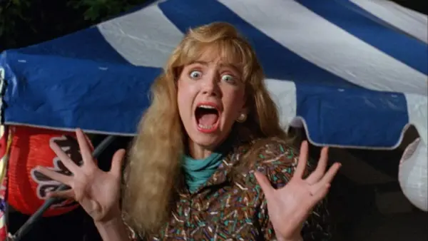 Image of a blond woman shrieking in the face of danger in Frankenhooker.