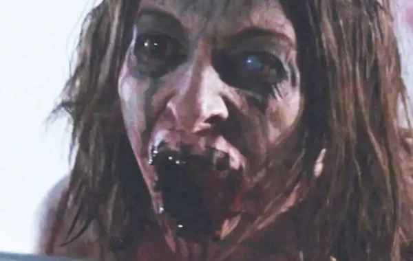 Image of a wild-eyed woman driven mad by torture. A scene from Martyrs, one of the nastiest movies on Tubi.
